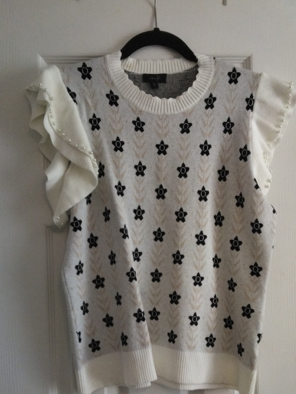 White Ruffle Sleeve Knit Top with Black Floral Motif